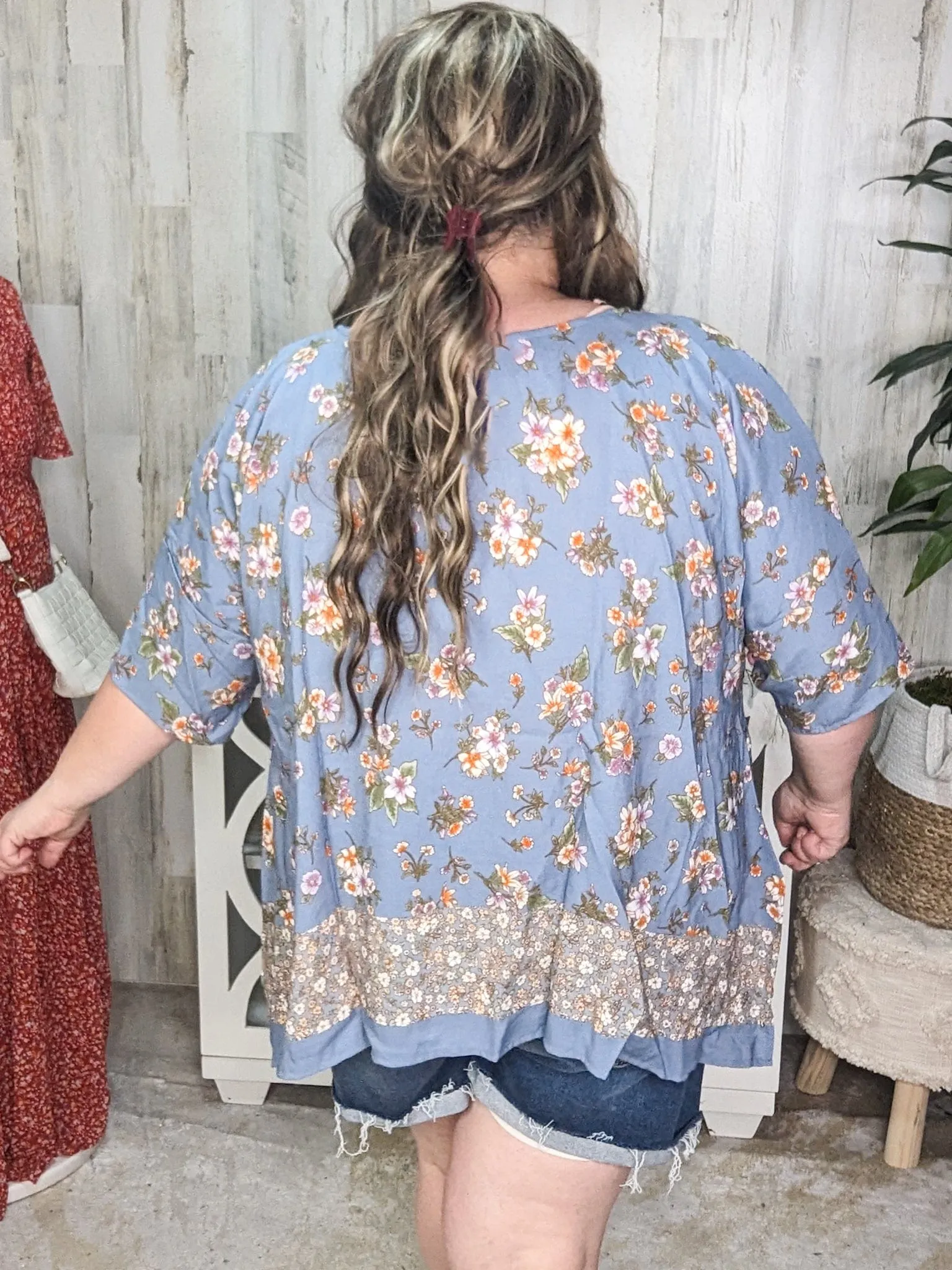 SALE- Constantine Sharkbite Hem Short Sleeve Top in Dusty Blue Florals