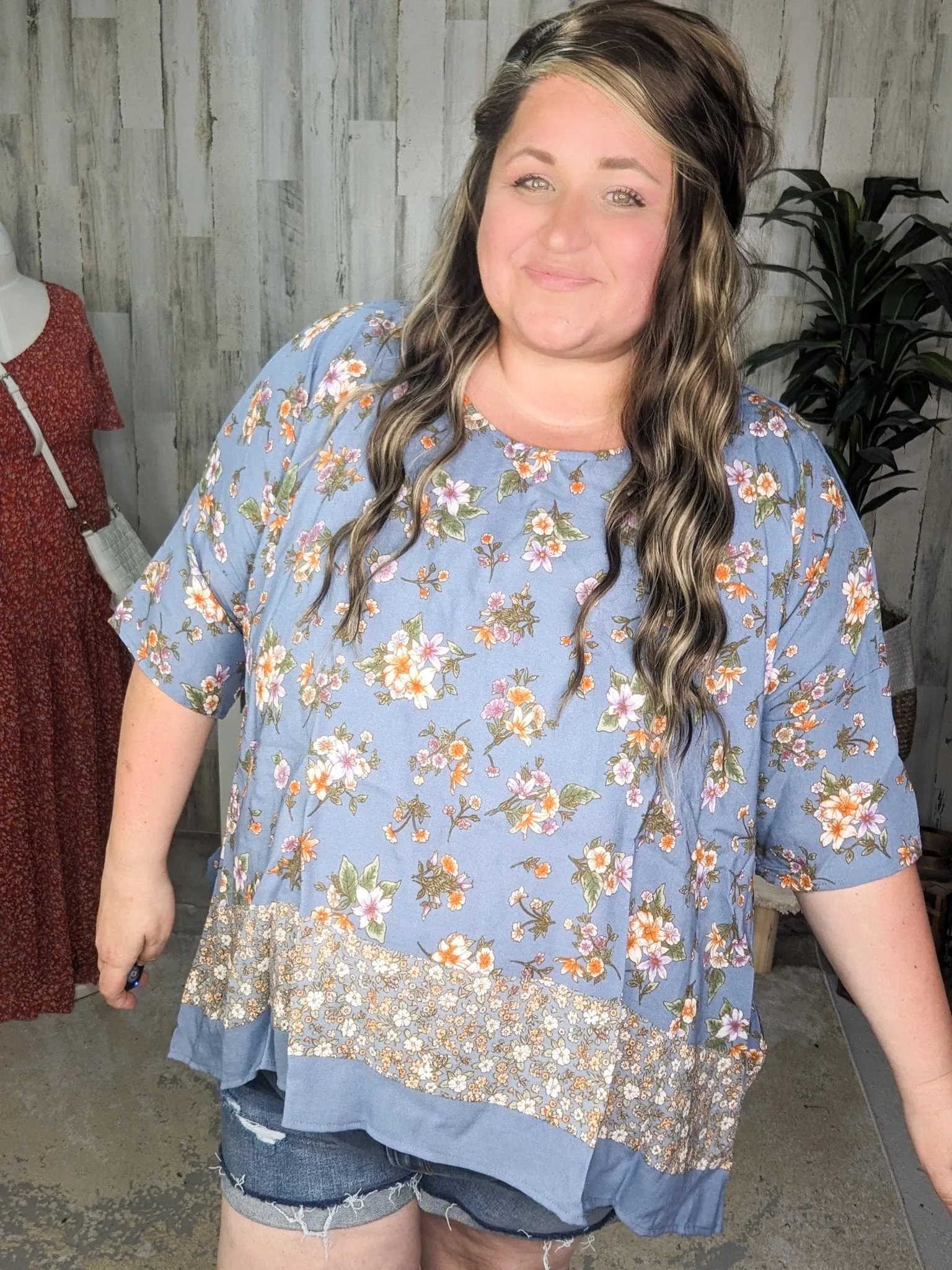 SALE- Constantine Sharkbite Hem Short Sleeve Top in Dusty Blue Florals