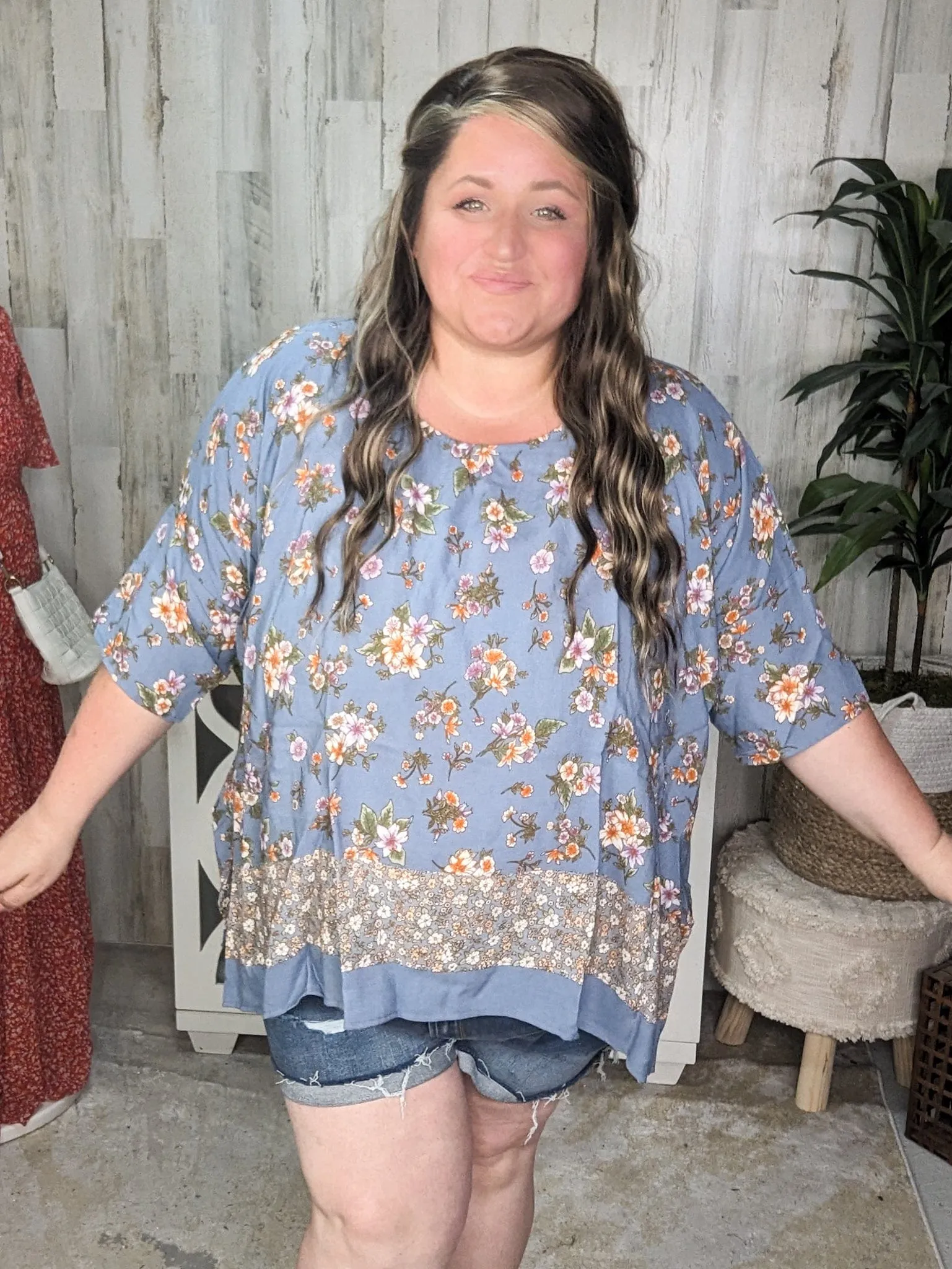 SALE- Constantine Sharkbite Hem Short Sleeve Top in Dusty Blue Florals